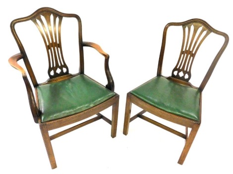 A set of eight mahogany dining chairs in George III style, each with a pierced vase shaped splat, a green leatherette drop in seat, on chamfered legs, two with arms.