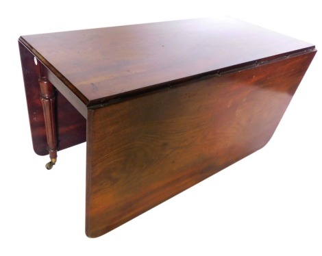 A large William IV mahogany drop leaf table, the rectangular top with a moulded edge and rounded corners, on turned tapering fluted legs, with brass castors, 73cm high, 139cm x 170cm.