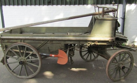 A military twin axle cart, harness and saddle.