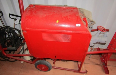 A vintage portable fire pump tender.