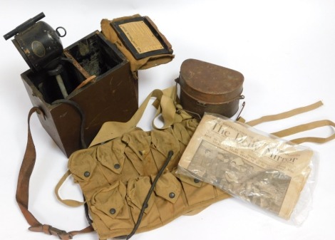 A World War I British signalling lamp, D shaped mess tin, and World War I American bandolier, etc.