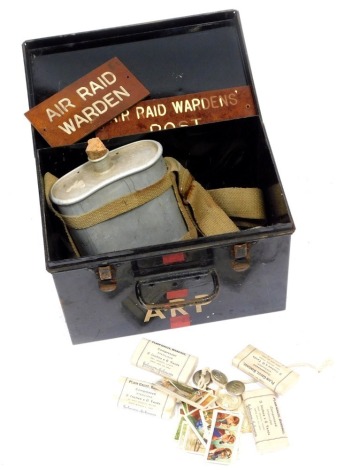 A World War II ARP first aid tin, cigarette cars, bandages, door signs, etc.
