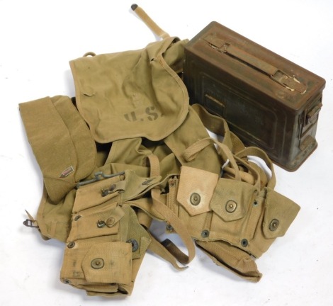 A World War II American webbing set, 30 cal ammunition box, and hat.