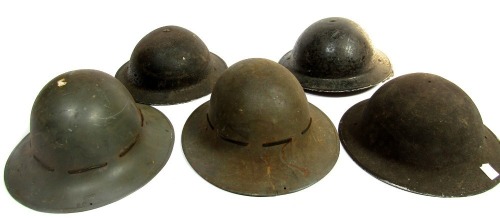 Various World War II tin helmets.