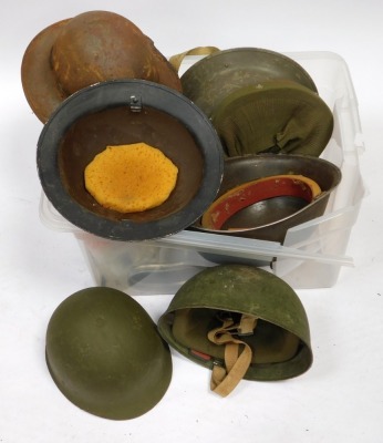 Various military tin helmets. - 2