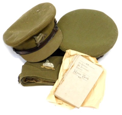 Various military hats, with Royal Lincolnshire and Lincolnshire Regiment badges on, together with hymn books.