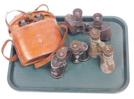 A selection of military binoculars, to include one pair of World War II German binoculars.