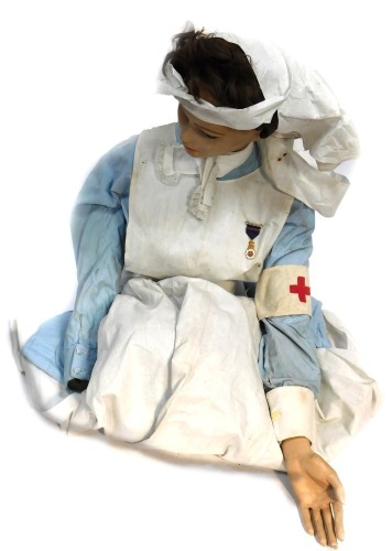 A World War I period nurse's outfit, on a female torso.