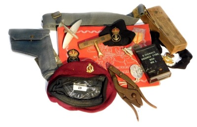 Various small items of militaria, to include Naval petty officer's cap badges, trench art Spitfire, RAF webbing, badges, etc.