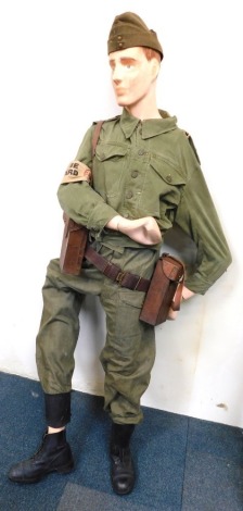 A mannequin wearing Home Guard style uniform, and associated leather webbing.