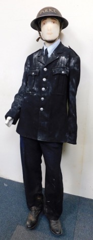 A mannequin wearing Derbyshire Police jacket, and World War II police tin helmet.