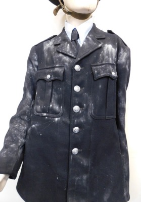 A mannequin wearing Derbyshire Police jacket, and World War II police tin helmet. - 3