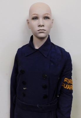 A child's mannequin portraying a fire guard. - 2