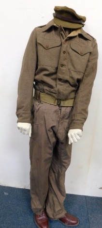 A male mannequin wearing Home Guard style uniform, and associated webbing belt and holster.