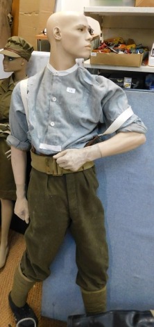 A male mannequin wearing military uniform.