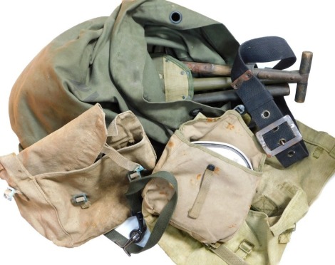 A quantity of military backpacks, fireman's belt, mess tin, etc.