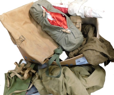 A box of militaria, to include signalling flag, webbing, first aid tin, etc.