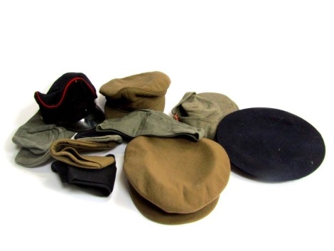 A large quantity of military hats, to include Russian and German examples.