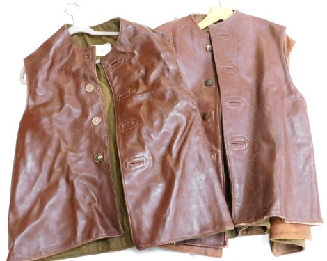 Three military leather jerkins.