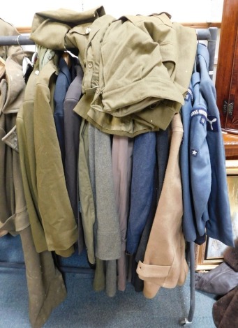 A large quantity of military related uniform, to include Royal Signals great coat, Royal Observer Corps jackets, RAF great coat, etc.