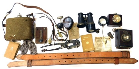 A selection of militaria, to include First World War and Second World War Bibles, First World War compass case, First World War wire cutters, etc.