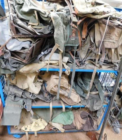 A large quantity of military backpacks, etc.