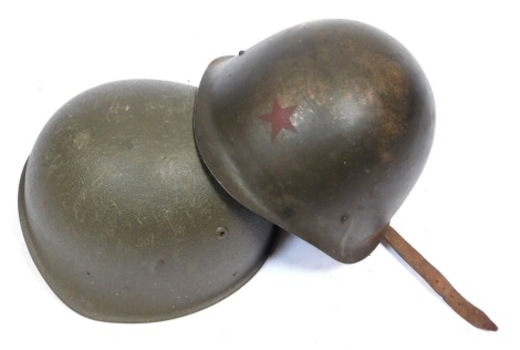 Two military helmets, to include a Russian Army example.