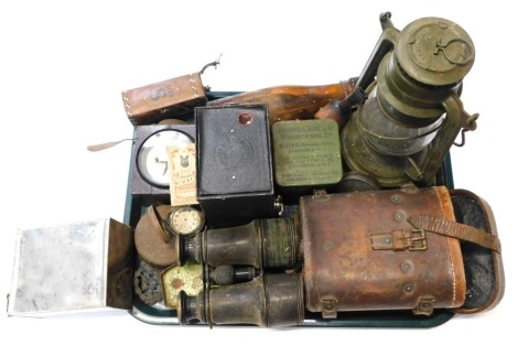 A selection of military items, to include World War I 1916 dated binoculars, dubbin tin, etc.