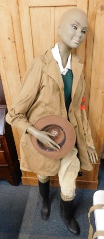 A female mannequin, depicting World War II land girl wearing World War II style items.