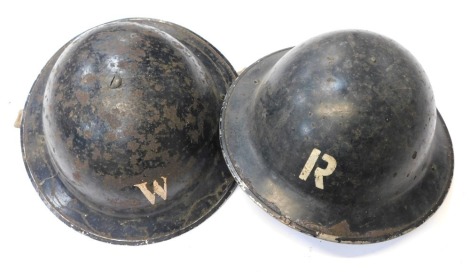 Two World War II Home Front tin helmets, warden and rescue.