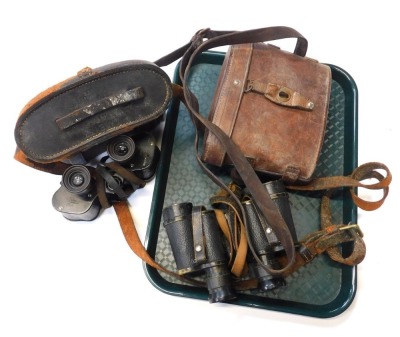 A selection of military binoculars, including World War I 1918 dated example.