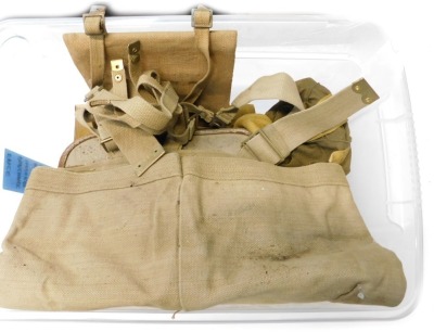 A box of military items, to include gas mask, leather box, map case, etc.