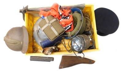 A box of assorted militaria, to include helmets, water bottles, entrenching tool, etc.