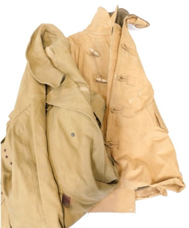 A World War II driving coat, together with later post war dispatch rider's overcoat.