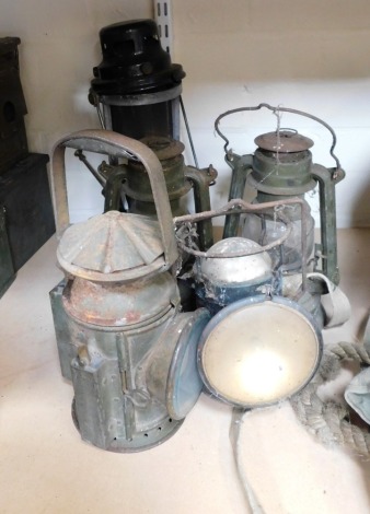 A 1945 dated military lamp, and other associated examples.