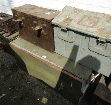 A wooden gun case, and two steel ammo cases.