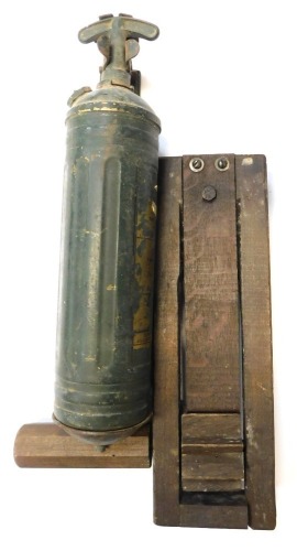 A military vehicle fire extinguisher, and anti gas rattle.