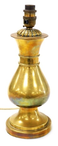 A brass baluster shaped vase, converted to a table lamp, 32cm high.