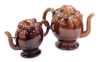 A pair of late 19thC graduated brown stoneware Cadogan teapots, moulded with fruit and flowers, 19cm and 15cm high respectively. - 2