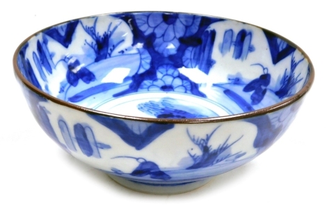 A 20thC Chinese blue and white bowl, decorated internally and externally with reserves depicting a figure fishing, unmarked, 16cm diameter.