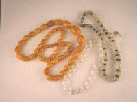 An amber necklace, a crystal bead necklace and a glass bead necklace<br