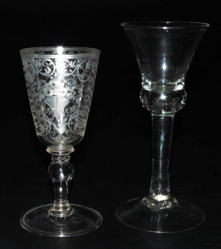 A Georgian balustroid wine glass, the bell shaped bowl with air bubble ...