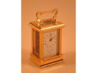 A Morrell & Hilton modern brass carriage timepiece in the French style