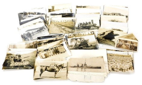 A collection of WWI photographs, depicting images of The Western Front, nurses, wounded, prisoners of war, series showing Queen Mary, King George, and The Prince of Wales visiting the Western Front, guns, tanks, etc., bearing various official photographs 