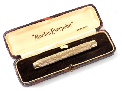 A Sampson Mordan 9ct gold press function retractable pencil, with engine turned decoration, boxed, 32.9g all in.