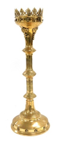 A Victorian brass Gothic Revival pricket altar candlestick, embossed with flower heads and engraved with leaves, 51cm high.