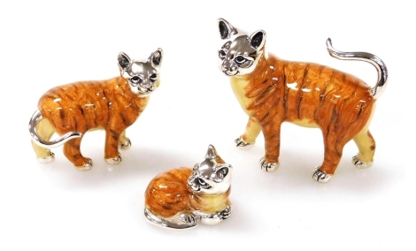 Three Saturno silver and enamelled figures of tabby cats, two in standing position, 4cm and 2.5cm high, the other in seated position, 2cm wide, each marked 925.