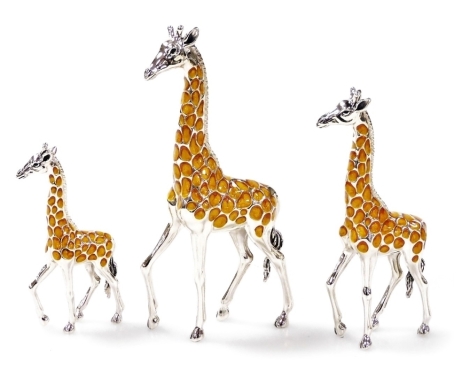 Three Saturno silver and enamelled models of giraffes, each in standing position, 11cm, 9cm and 7cm high, each marked 925.