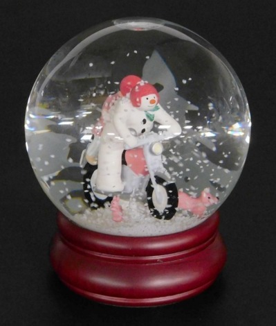 A Coalport Characters The Snowman snow globe, Hold On Tight, 14cm high.