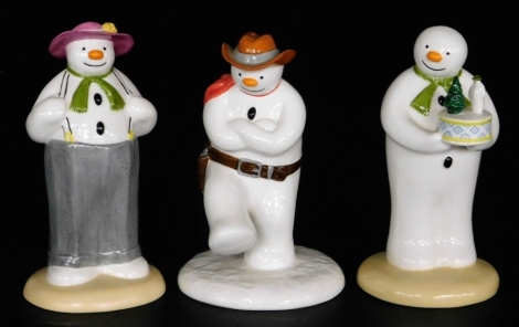 Three Coalport Characters porcelain The Snowman figures, comprising Dressing Up, Snowman's Surprise, and Cowboy Jig.